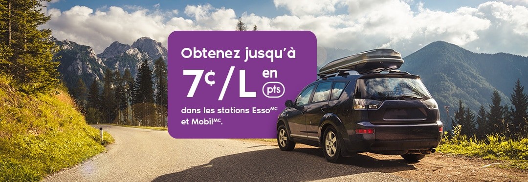 Un véhicule utilitaire sport circulant sur une route montagneuse.