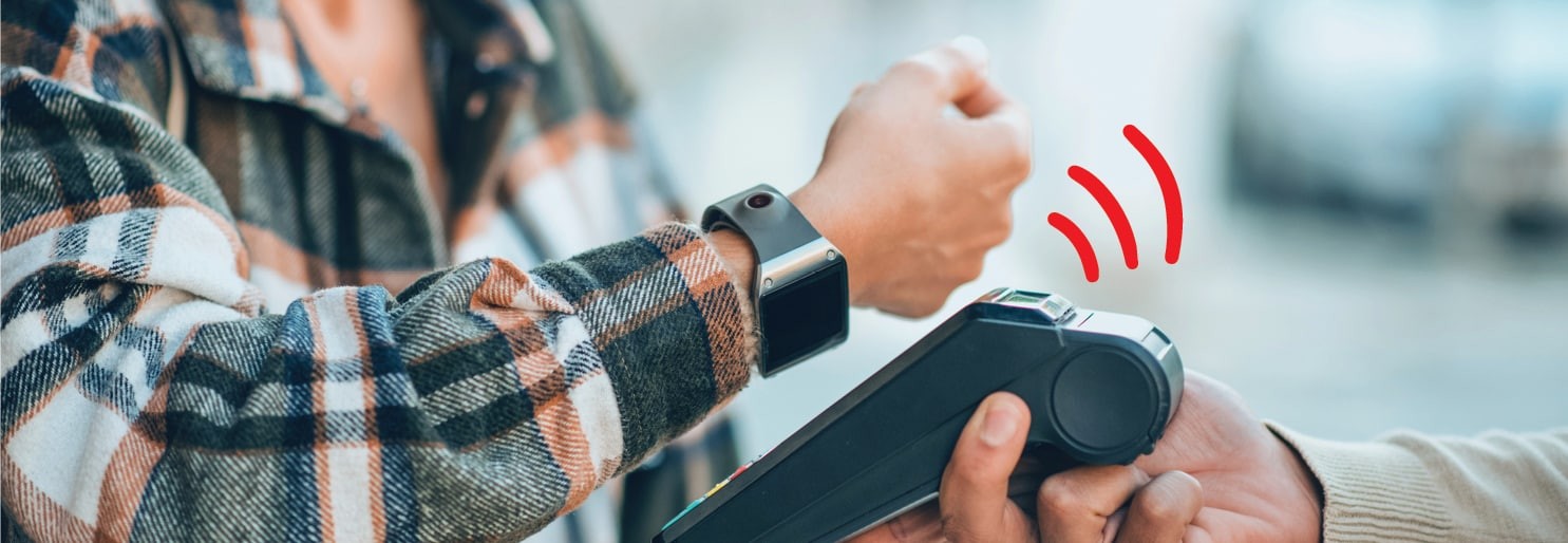 person using a smart watch to mobile pay