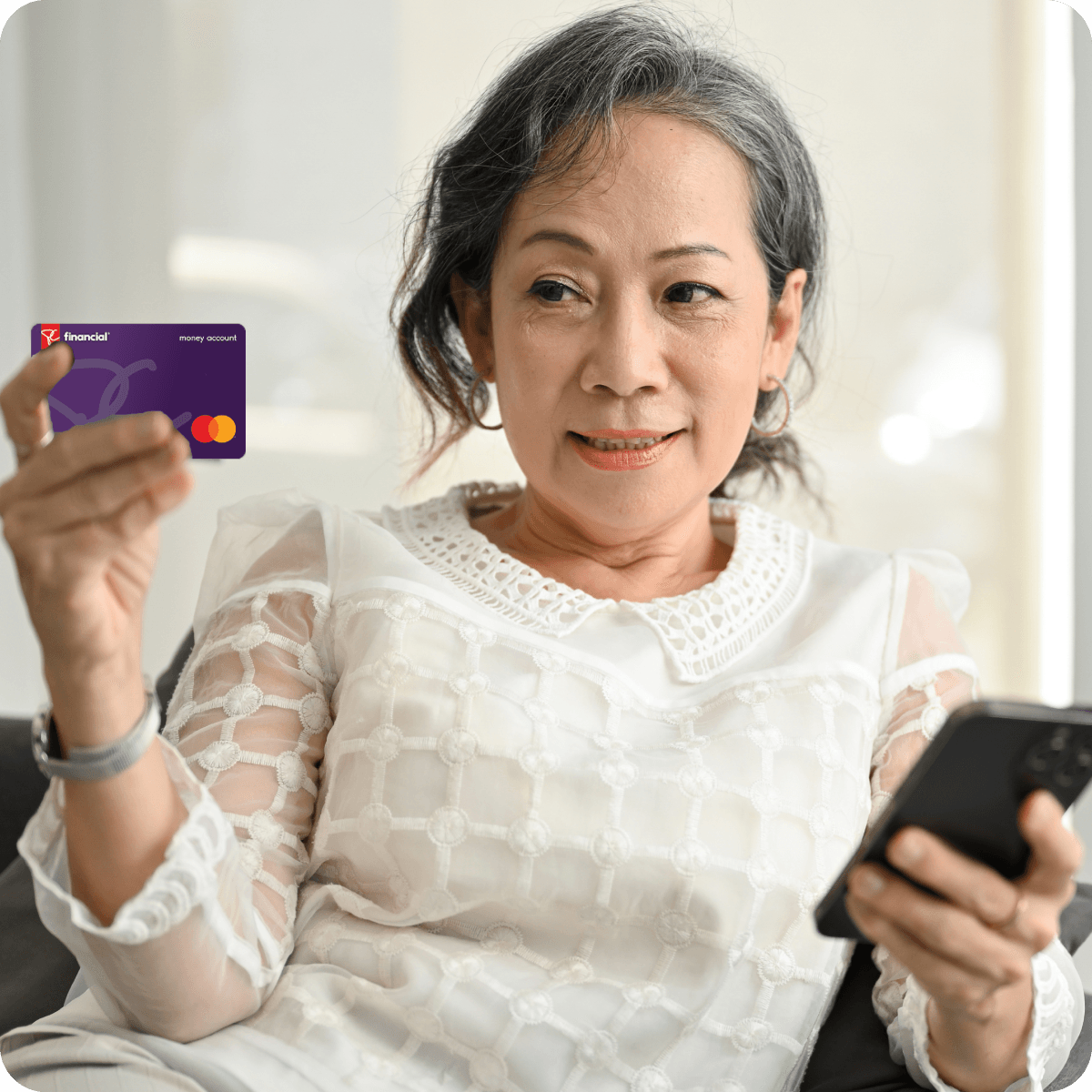 Woman looking at PC Financial Card